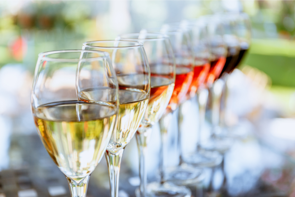 A lineup of wine glasses with red, white and rosé wine